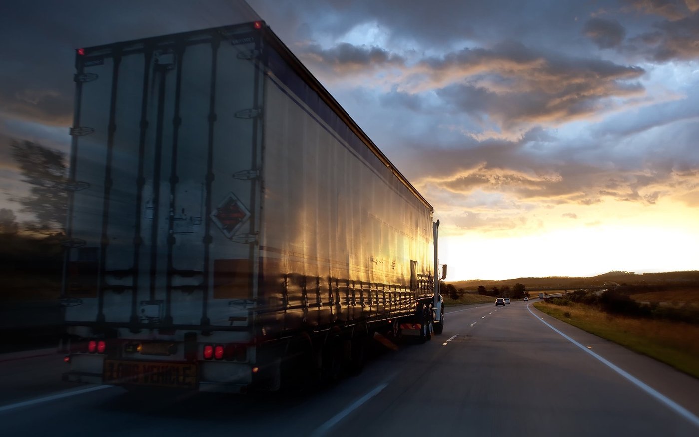Freight trailer on the highway at sunset